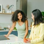 Accueil Dietary consultation in a home kitchen with nutritionist and client discussing healthy eating.